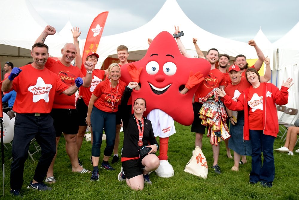 Action for children team celebrating an event